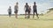 Video of happy diverse boys playing soccer on sports field