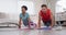 Video of happy diverse couple training together at home, doing plank