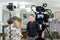 Video of the interview. Television equipment, camcorder with LCD screen, lighting equipment.