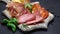 Video of italian meat plate - sliced prosciutto, sausage and cheese