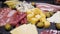 Video of italian meat plate - sliced prosciutto, sausage and cheese