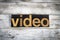 Video Letterpress Word on Wooden Background