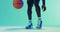 Video of low section of african american male basketball player bouncing ball on blue background