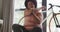 Video of midsection of plus size african american woman in sport clothes stretching at home