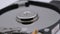 Video of Opened Hard Disk Drive with spinning platter. Close up of a hard disk drive reading and writing data. Disassembled hdd