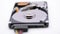 Video of Opened Hard Disk Drive with spinning platter. Close up of a hard disk drive reading and writing data. Disassembled hdd