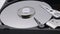 Video of Opened Hard Disk Drive with spinning platter. Close up of a hard disk drive reading and writing data. Disassembled hdd