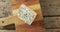 Video overhead shot of wedge of blue cheese on chopping board, on rustic wooden table