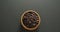 Video of overhead view of wooden bowl of chocolate chip over grey background