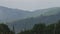 Video pan of some green foggy mountains