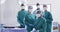 Video portrait of diverse group of surgeons ready for surgery in operating theatre