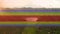 Video of rainbow lines over moving countryside landscape