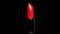 Video of a red lipstick rotating in studio