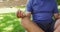 Video of relaxed biracial senior man practicing yoga in garden