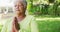 Video of relaxed biracial senior woman practicing yoga in garden