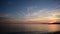 Video of the slow sunset on the beach looking at the Mediterranean Sea