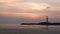 Video of small lighthouse against a tropical ocean sunset and smooth water at Khao Lak Beach in Phang Nga,Thailand.