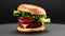 Video of tasty burger rotating on dark background