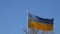 Video of waving Ukrainian flag on a blue clear sky in Prague