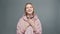 Video of young praying woman in pink sweatshirt