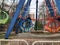 Vidnoe, Russia - April 15, 2021: Repairing carousels in park, repairman repairing a Ferris wheel booth