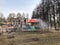 Vidnoe, Russia - April 15, 2021: Washing carousels in a city park, spring preparations. Red mushroom under running water