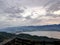 Vief of line of mountains and lake with broken wood fence