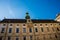 Vienna, Austria: Hofburg palace and panoramic square view, people walking and fiaker with white horses in Vienna, Austria