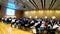 Vienna, Austria - July 18, 2019 People listening to an European scientific conference talk in time lapse