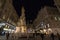 VIENNA, AUSTRIA - NOVEMBER 6, 2019: Wiener Pestsaule, also called the Plague Column, on Graben street, at nights, with pedestrians