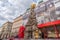 VIENNA, AUTRIA - OCTOBER 10, 2016: Vienna Old Town Street with Tourists. Plague Column Holy Trinity column located on the Graben,