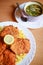 Vienna food - Wiener Schnitzel with french fries and slice of lemon, fried pork chop,FiglmÃ¼ller Schnitzel & Frittaten