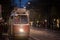 Vienna tram, also called strassenbahn, leaving a tram station at night in the center of the city.