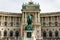 Vienna, Vienna State/Austria - April 4 2018: Prince Eugene Statue and behind that the building of the Papyrus Museum Vienna