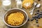 Viennese wafers in metal bowl. Waffles and berries, spoon and fork on table. Milk in glass and bottle