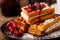 Viennese waffles with powder and berries