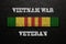 Vietnam Campaign Ribbon with text Vietnam War Veteran. Vietnam Veterans Day.