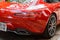 Vietnam, Hanoi, December 06, 2016: Red supercar Mercedes GTS on a street of city. Fragment of exterior of car