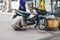 Vietnam, man repairs motorcycle on the street