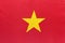 Vietnam national fabric flag with emblem, textile background