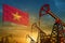 Vietnam oil industry concept. Industrial illustration - Vietnam flag and oil wells against the blue and yellow sunset sky