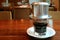 Vietnamese Drip Coffee trickled Into Transparent Cup Almost Ready for Drinking