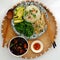 Vietnamese family meal for lunch with vegetarian food, vegetables, avocado with sauce, seaweed soup, vegan dish for dieting