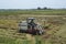 Vietnamese farmer pick rice up with a combine harvester