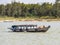 Vietnamese fishermen on a boat catching fish, Mekong river delta area