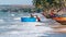 Vietnamese fishermen are pushing their fishing coracle out to the sea for their daily duty at Fisherman Village, Mui Ne, Vietnam