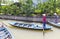 Vietnamese with long boats waiting for tourist to give them a ride on Mekong rive, Vietnam