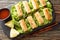 Vietnamese nems or deep fried spring rolls with chicken closeup on the plate. Horizontal top view