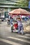 Vietnamese old women pushing a trolley