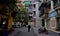 A Vietnamese person walks in a colorful Hanoi Street